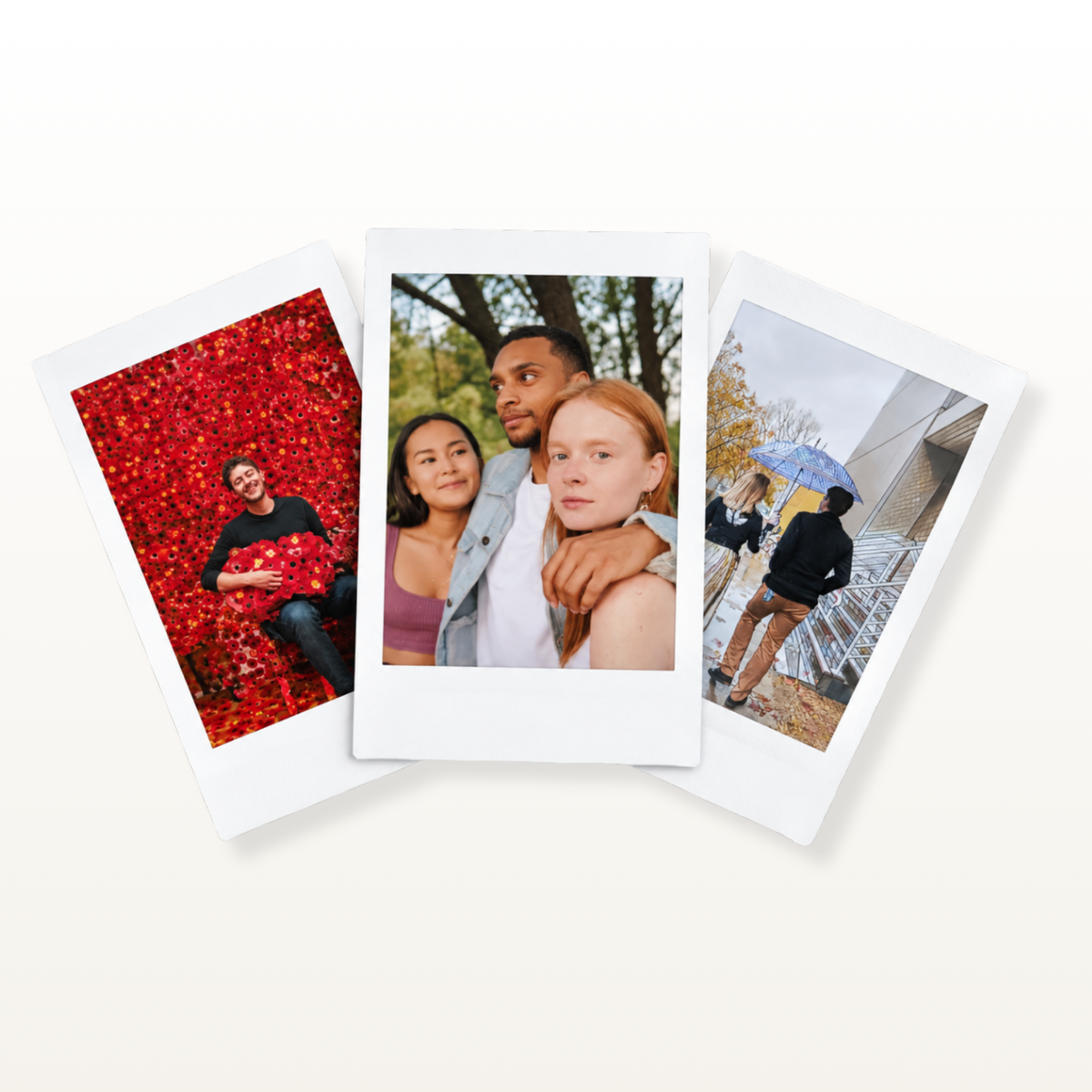 Three overlapping Polaroid-style photo prints, displayed on a light beige background. The left print shows a man lying on a bed of red leaves, the center print shows a couple embracing outdoors, and the right print shows a person walking under an umbrella near a building.
